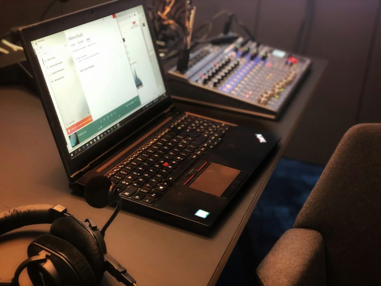 a laptop computer sitting on top of a desk